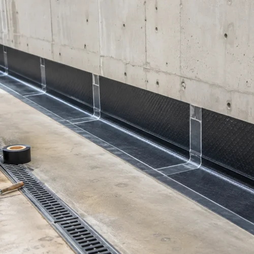 Basement retaining wall waterproofing membrane detail with drain channel in Saudi Arabia